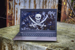 laptop with pirated content on the screen