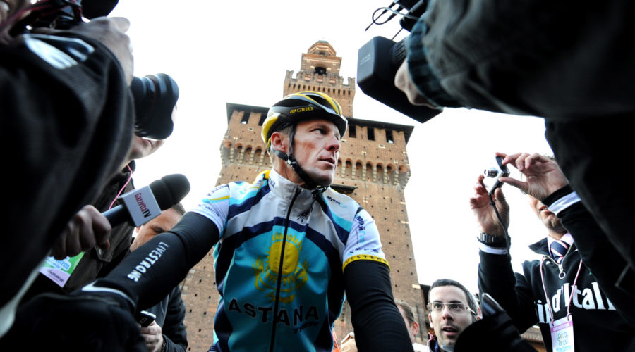cyclist Lance Armstrong of Team Astana waves prior the start of the 100th Milan San Remo classic cycling race in Milan, Italy - 21 March, 2009