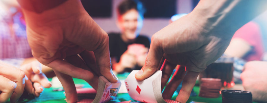 poker dealer shuffling cards
